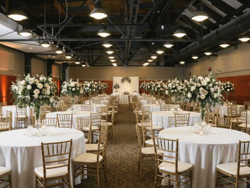 Elegant wedding reception with round tables and floral centerpieces at the Ortiz Center in Corpus Christi